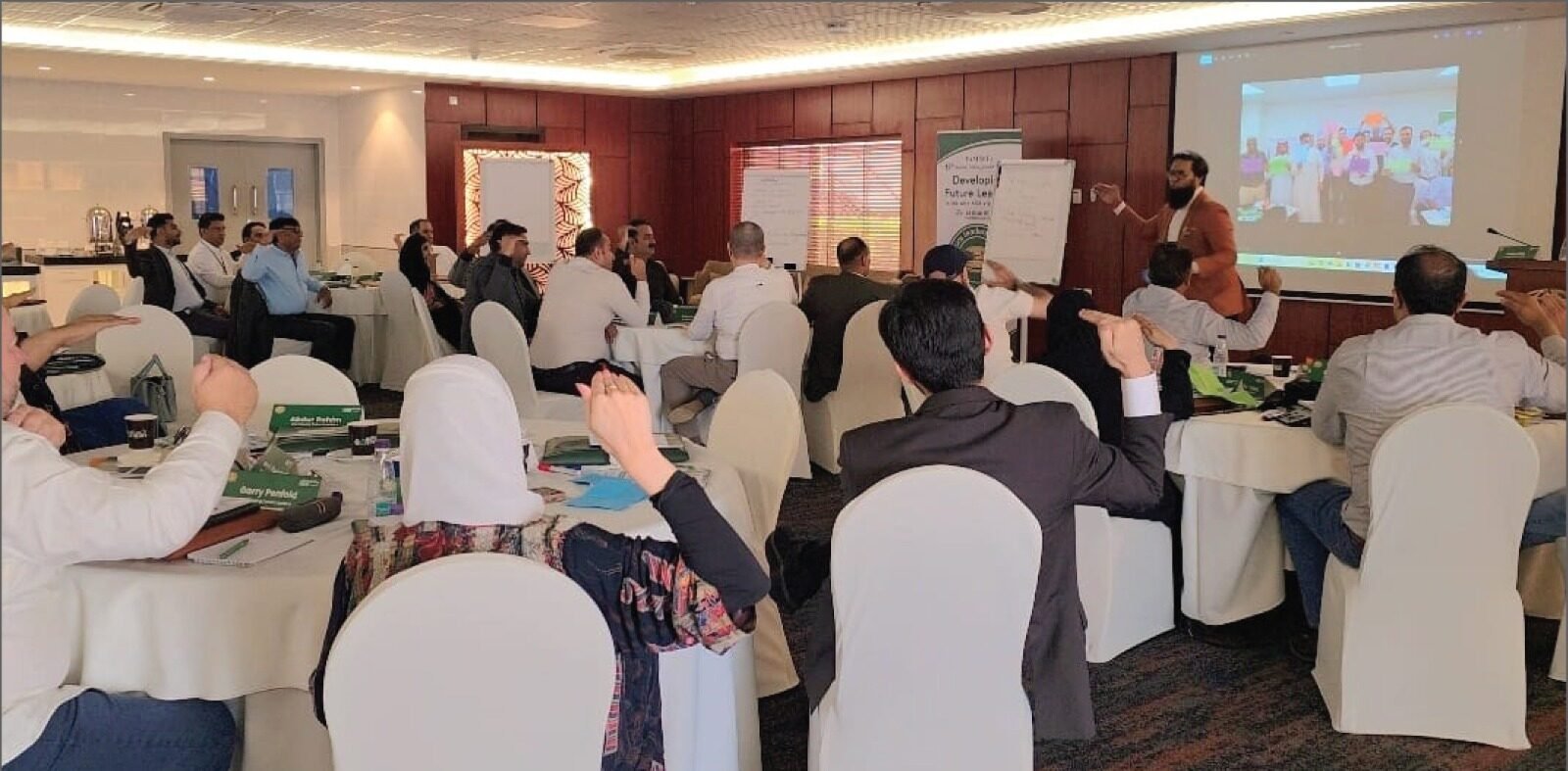 Participants learning together in a Million Smiles Global conference room