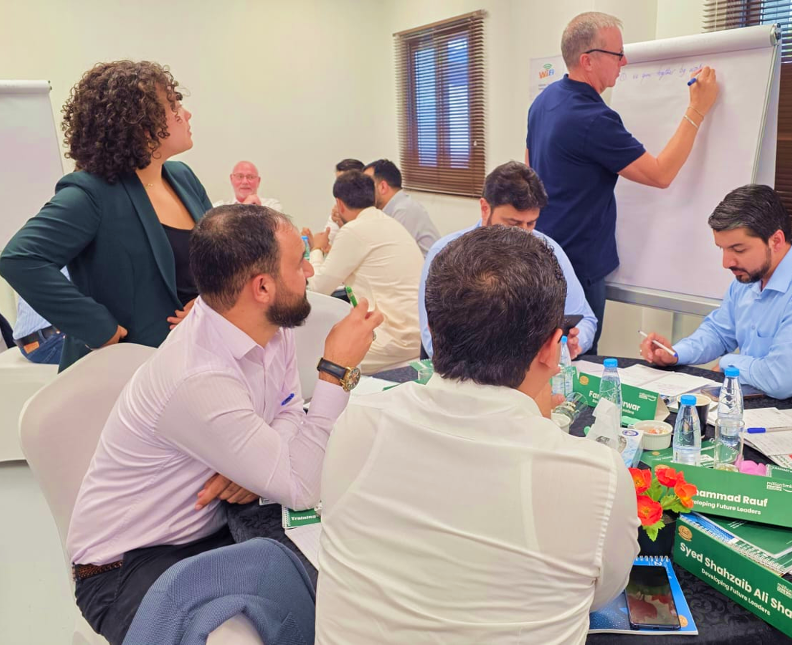 A small-group leadership discussion with facilitators at Million Smiles Global